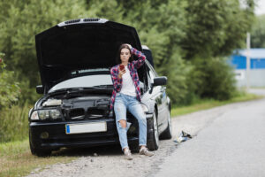 long shot woman sitting car